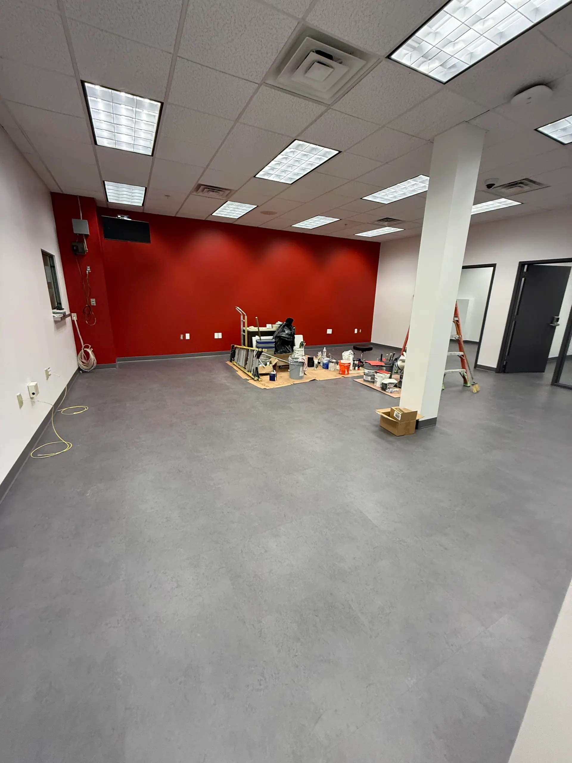 Commercial interior with a bold red accent wall